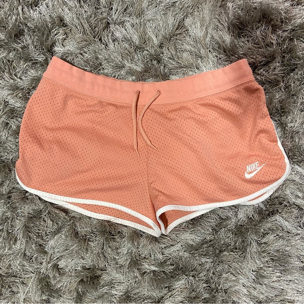 Nike women peach and white drawstring waist lined running shorts. Size L. Used.